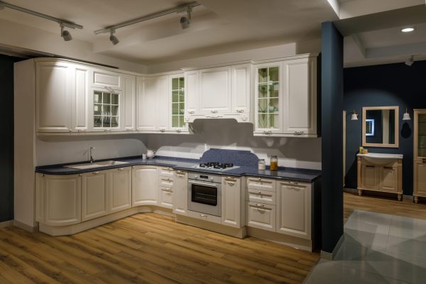 Renovated kitchen interior in white and blue tones